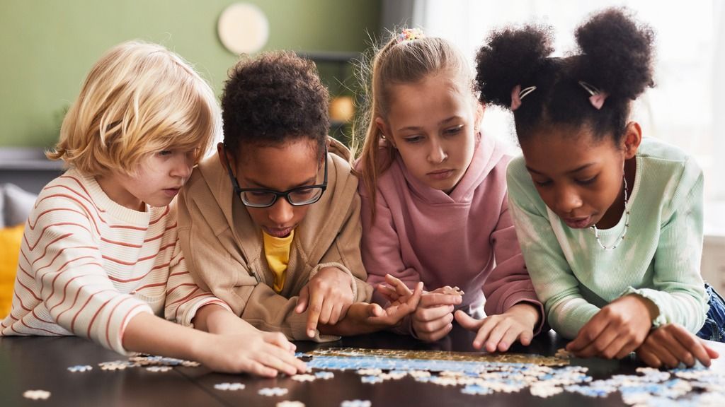 Children playing with a puzzle